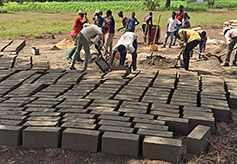 The block is  immediately removed from the mold and placed on the ground to dry