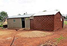 Stucco Being Applied to Mud Bricks