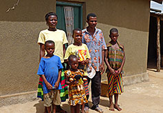 Pastor Sato and Family Pose for a Photo Inside the Courtyard