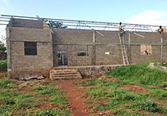 Roofing supports are attached to the trusses