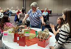 Helpers receiving last-minute raffle instructions