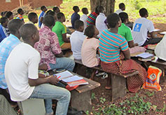 Villagers Using New Testaments