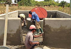 The enclosure is covered with cement before it is painted