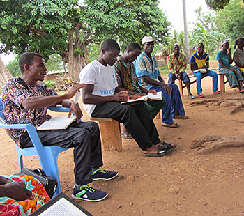 Church meeting under a mango tree